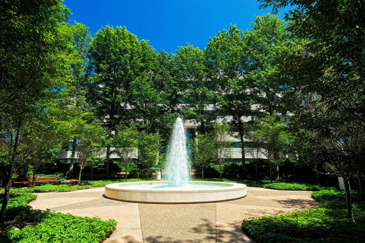 The courtyard fountain surrounded by trees at Neshaminy Interplex